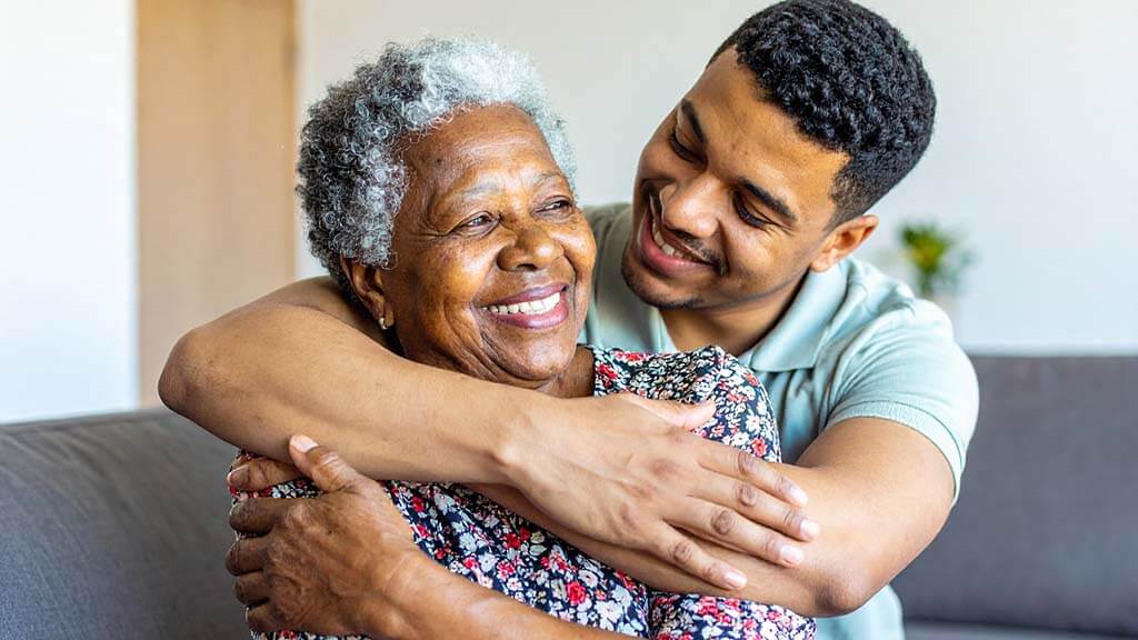 African-American elderly woman with her son