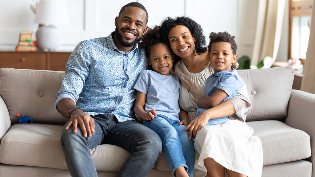 Husband and wife with a young son and daughter