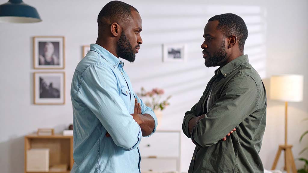 Two African-American brothers arguing